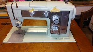 lot 87 image: Sears Kenmore Sewing Machine with Cabinet and notions.