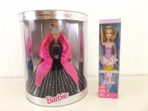 lot 45 image: 1998 Never Removed From Box Holiday Barbie and a 2002 Barbie