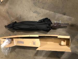 lot 50 image: California Umbrella 7-12 ft. Aluminum Push Tilt Patio Market Umbrella in Black Olefin   Customer Returns See Pictures