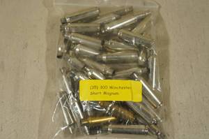 lot 140 image: 35 Empty 300 Win Short Mag Casings