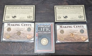 lot 25 image: Three Collectible Coin Sets