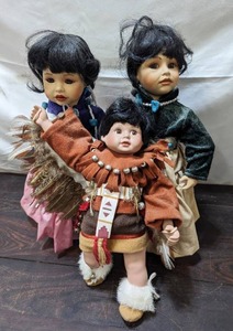 lot 43 image: Three Porcelain Native American Dolls