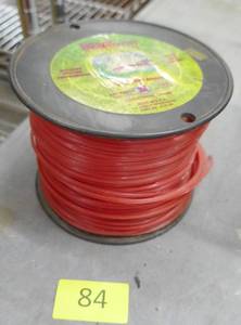 lot 84 image: New roll of 235 yards of weed whip line size .105