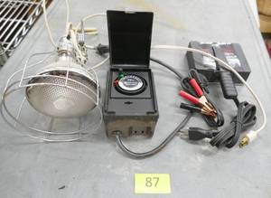 lot 87 image: Garage light, sprinkler timer, magnetic engine block heater, box of hose