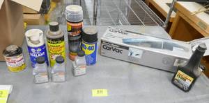 lot 88 image: Stihl 2 cycle engine oil, Car vac, starting fluid, tire seal