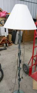 lot 92 image: Floor lamp about 4 ft tall, metal leaf