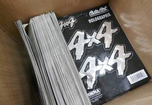 lot 169 image: Box of 4x4 decals, guessing 100