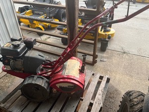 lot 14 image: Earth Quake rear tine tiller  needs repair