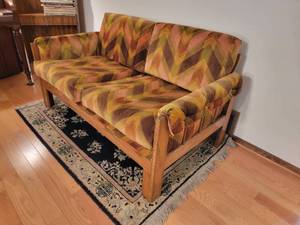 lot 14 image: Retro Spinal Frame Low Profile Loveseat from Howard Furniture