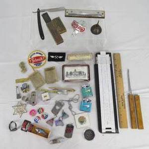 lot 87 image: Lighters, Slide Rule, Straight Razor, Paperweight, Pins, & Other Small Collectibles