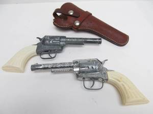 lot 163 image: Pair of Vintage PNY Six Shooter Cap Guns