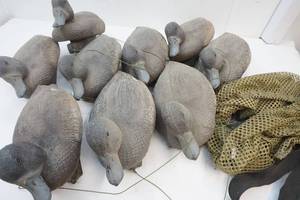 lot 22 image: Plastic decoys, weights and bag.