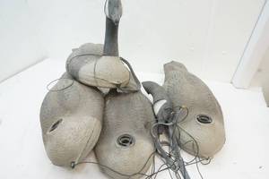 lot 24 image: Plastic decoys, weights and bag.