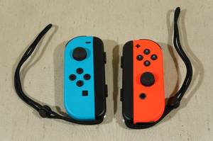 lot 184 image: Nintendo Switch Joy-Cons -Neon Red & Blue