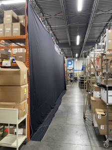 lot 58 image: Large Black Theatrical Backdrop 30 Long with MillerKnoll Branding - Heavy Duty
