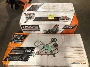 lot 15 image: RIDGID 15 Amp 12 in. Corded Dual Bevel Sliding Miter Saw with 70 Deg. Miter Capacity with Professional Compact Miter Saw Stand Customer Returns See Pictures