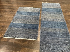 lot 58 image: Two Coordinating Rugs