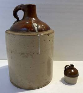 lot 122 image: Two Stoneware Jugs 1 Miniature 2 34 1 Larger With Leather Strap 11