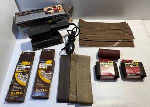 lot 233 image: Black & Decker finishing Sander And Misc. Sanding Belts