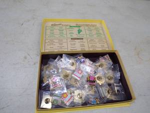 lot 11 image: 30 Olympic Pins in Whitmans Candy Box