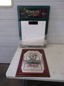lot 14 image: New in Package Never Used Odouls Menu board and Christian Bros Mirror
