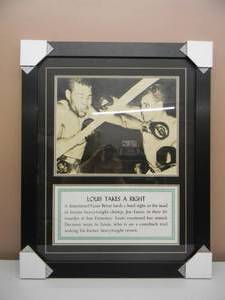 lot 2 image: EXTREMEMLY RARE ORIGNAL FIGHT PHOTO JOE LOIIS TAKES A RIGHT FROM CESAR BRION. Approximately 26x 32 SEE PICTURES