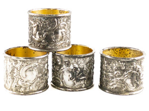 lot 78 image: Holiday Imports Inc. Set of 4 Napkin Rings Silverplate Hollowware.