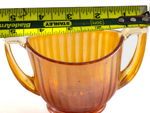 lot 104 image: Imperial Glass Luster and Clear Marigold (Carnival) Open Sugar Bowl, 2 78in H Carnival Glass. 2 78in x 5 14 in