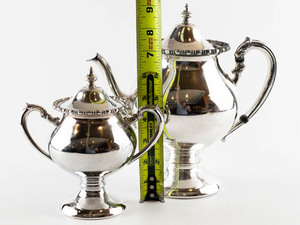 lot 54 image: Lehman Brothers Teapot and Sugar with Lid Silver on Copper Hollowware.