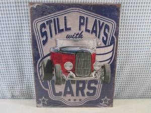 lot 12 image: (C-2) Still Plays with Cars Tin Sig...
