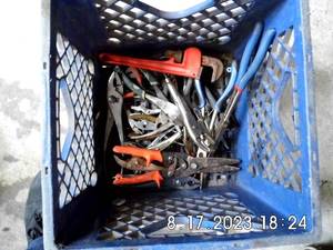lot 43 image: Plastic crate with a large assortment of slip-joint, diagonal and needle nose pliers PLUS cutting tools, Vise grips, and a pipe Wrench