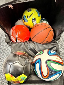 lot 25 image: REEBOK Ball Bag on Wheels with Back Straps and Various Sports Balls