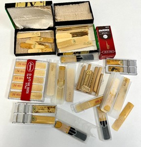 lot 77 image: Various Musical Reeds, Drumsticks, Straps, Sheet Music Folder and other items