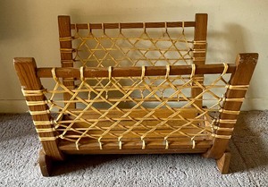 lot 53 image: Bent Wood and Rawhide Log Holder by Vermont Tubbs