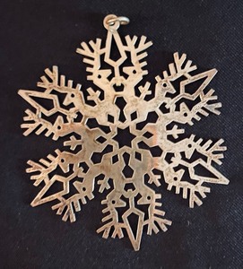 lot 83 image: Two Metropolitan Museum of Arts Sterling Silver Snowflake Ornaments