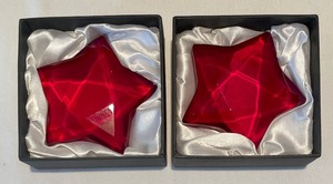 lot 262 image: Pair of Red Star Paperweights by Rosenthal