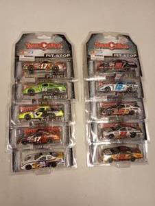 lot 69 image: Team Caliber Pit Stop 164th Scale Die Cast Cars