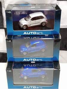lot 166 image: (3) Autoart Chrysler Panel Cruiser 143rd Scale Die Cast Cars
