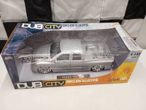 lot 222 image: Dub City Big Ballers Dodge Ram 118th Scale Die Cast Car.