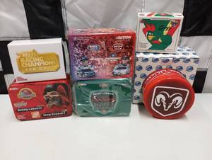 lot 231 image: Assorted Nascar Tins  Boxes With 164th Scale Die Cast Cars