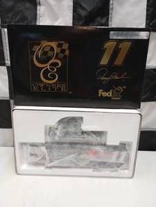 lot 294 image: Owners Elite Denny Hamlin #11 Fed Ex Express 124th Scale Die Cast Hauler Coin Bank.