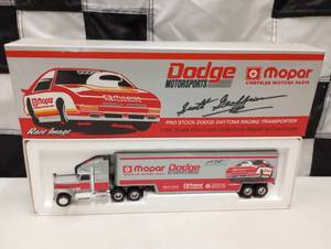 lot 297 image: Ertl  Mopar Dodge Motorsports 164th Scale Die Cast Hauler.