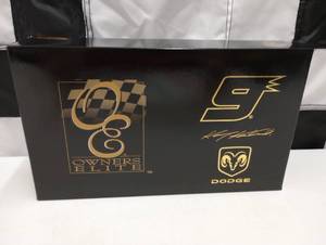 lot 496 image: Owners Elite Kasey Kahne #9 Dodge Dealers 164th Scale Die Cast Hauler Bank.
