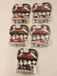 lot 614 image: Checkerboard Flag Sports 164th Scale Die Cast Cars.