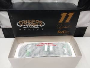 lot 698 image: Owners Club Select Denny Hamlin #11 FedEx Ground 124th Scale Die Cast Car