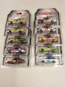 lot 1006 image: Team Caliber Pit Stop 164th Scale Die Cast Cars