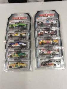 lot 1003 image: Team Caliber Pit Stop 164th Scale Die Cast Cars