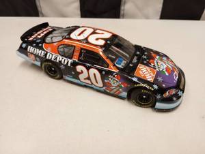 lot 1021 image: Owners Elite Tony Stewart #20 Sam Bass Holiday 124th Scale Die Cast Car