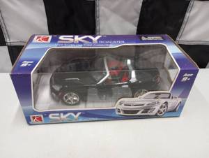 lot 1061 image: Saturn Sky Roadster 124th Scale Die Cast Car