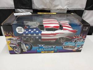 lot 1093 image: 1957 Chevy Muscle Machines 118th Scale Dicast Car